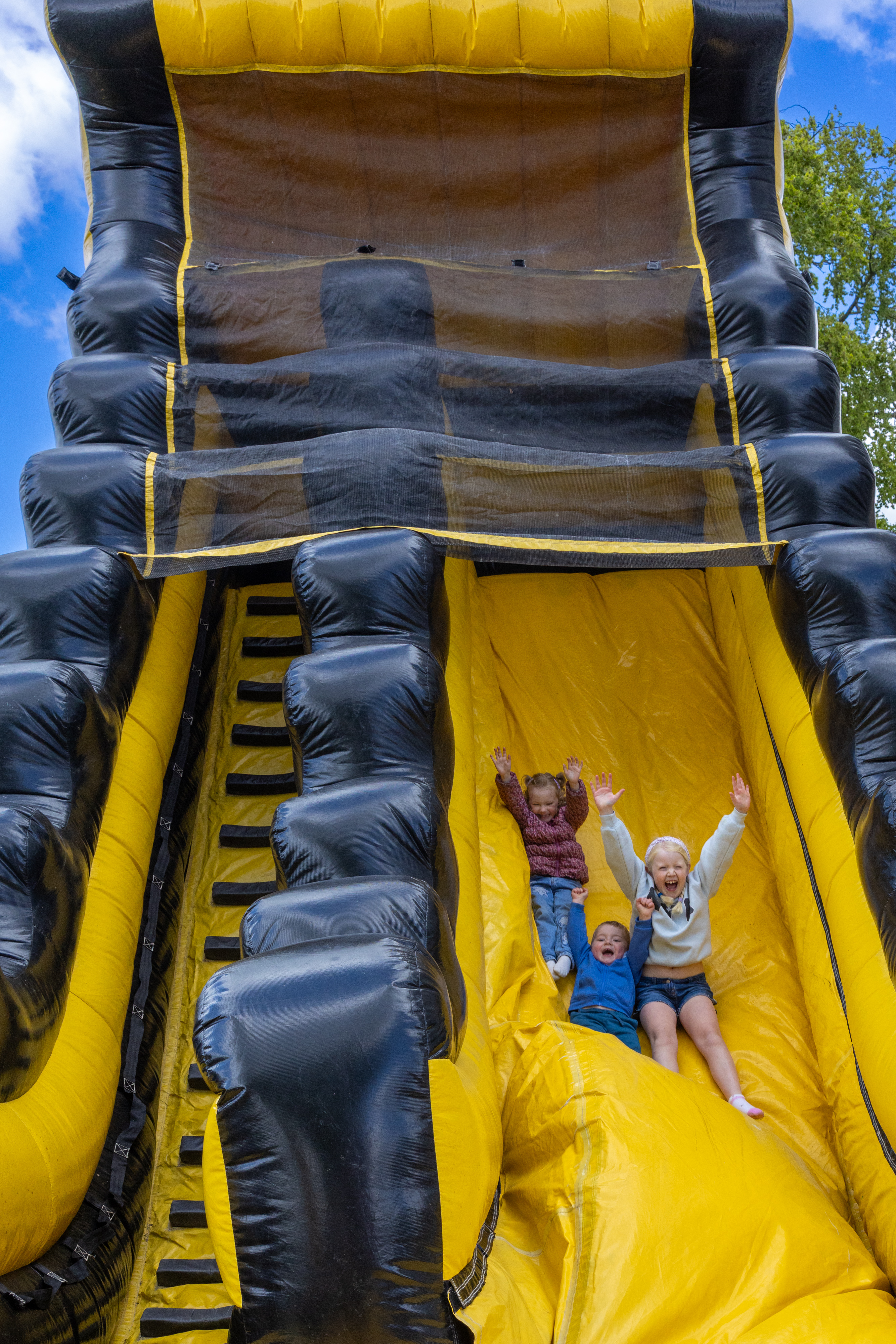 Children playing on a bouncy castle. 